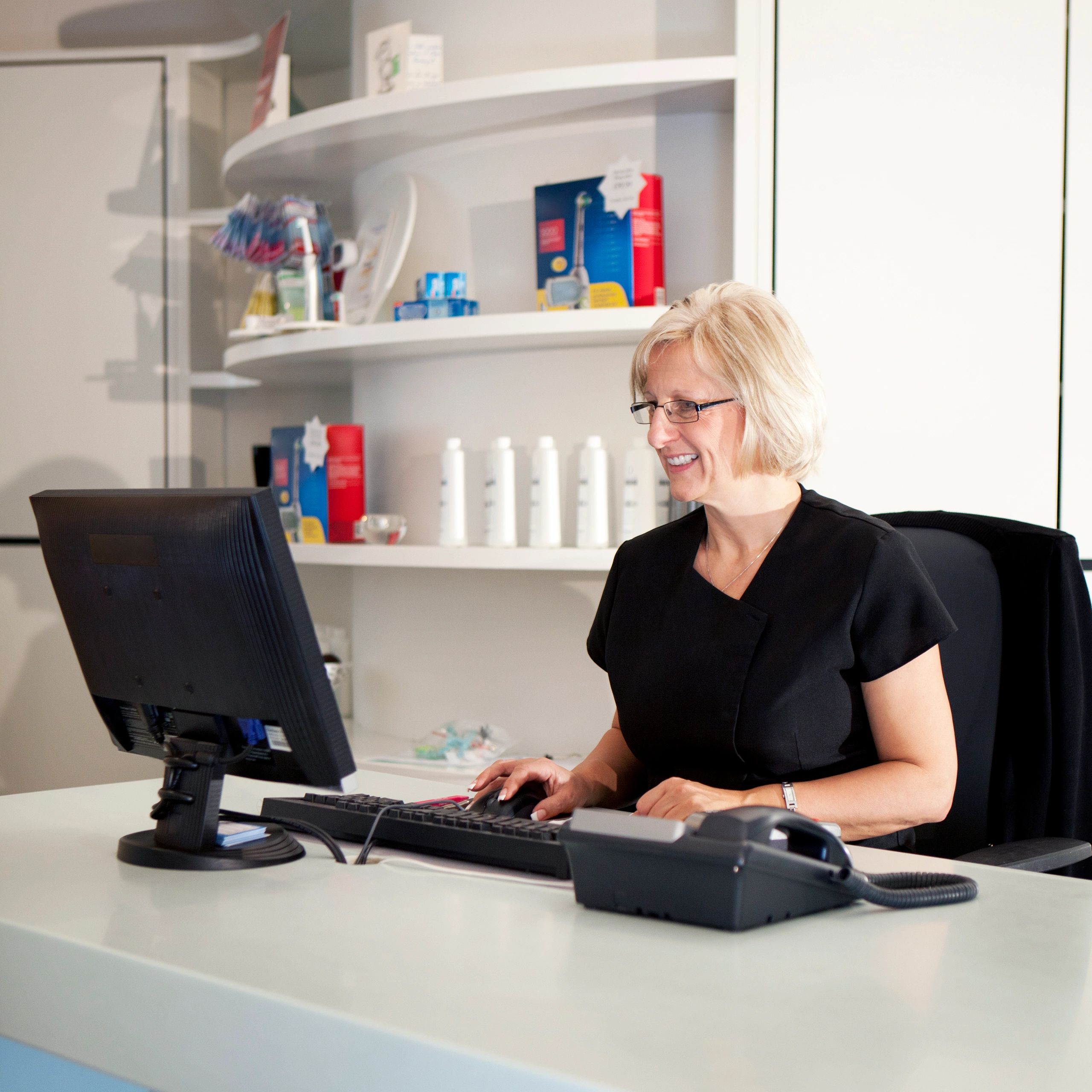 Customer support representative assisting Alpha-RX customers