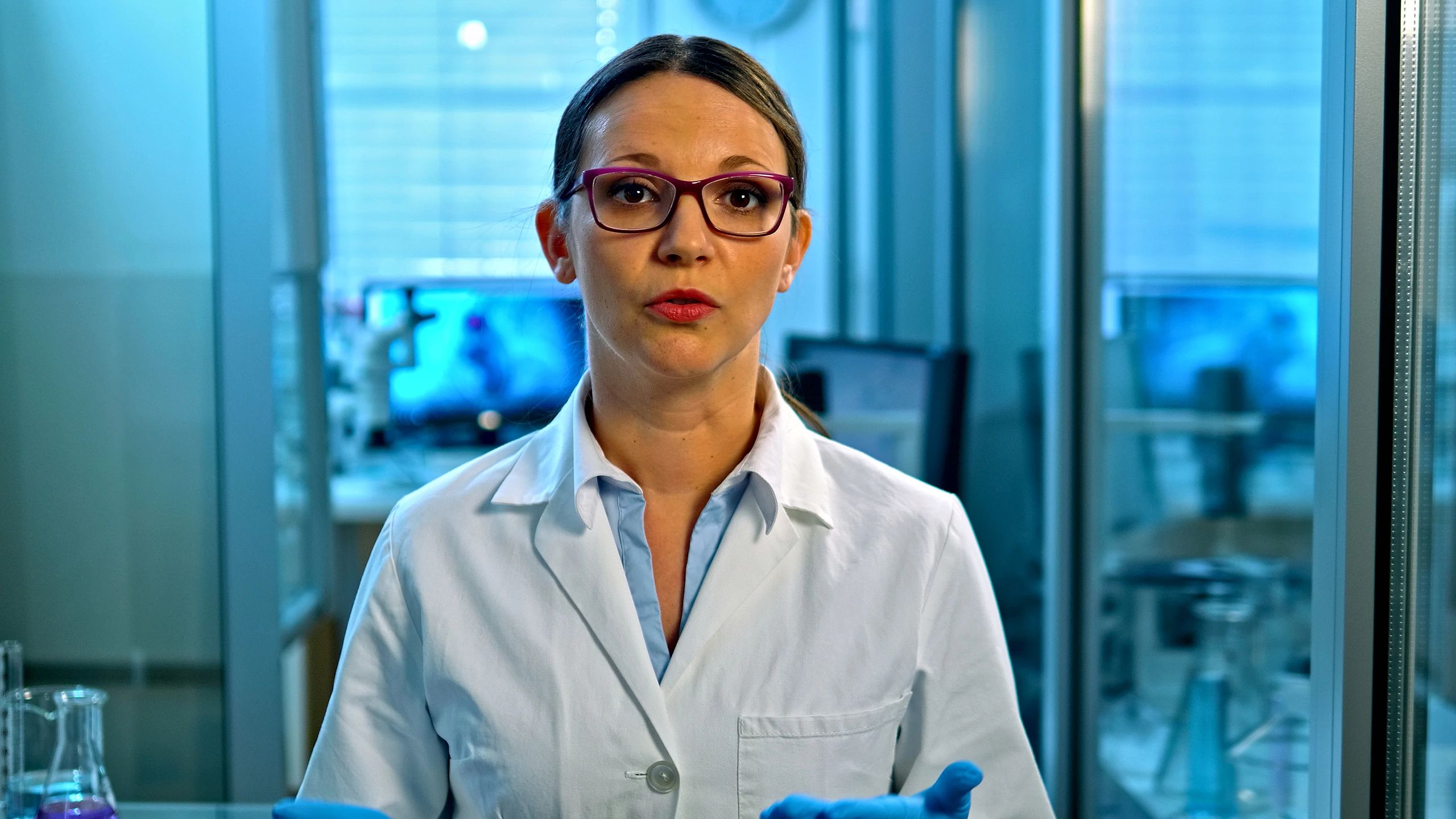 Scientist presenting lab testing process in a high-tech facility