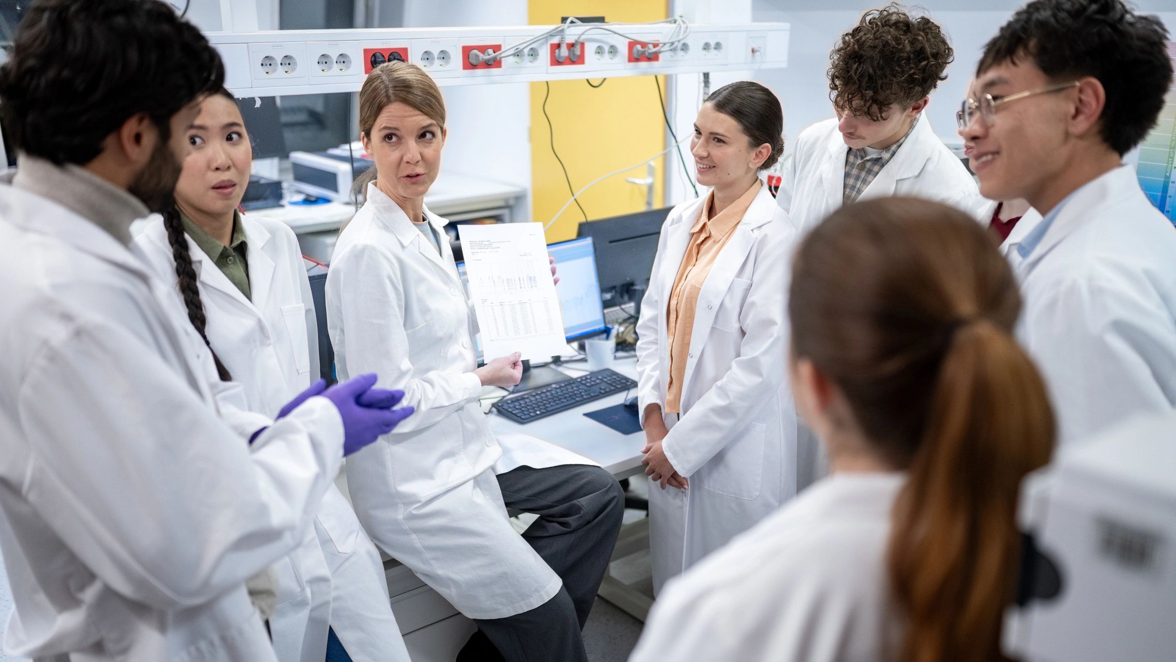 Alpha-RX team collaborating in a modern laboratory